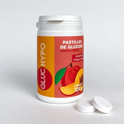 Pot de 50 pastilles de glucose pêche Gluc Hypo ouvert avec deux pastilles blanches devant